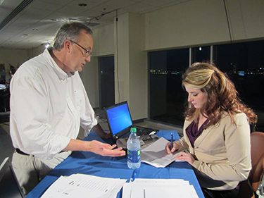 hendry_election Journalism instructor Stephen Puddicombe gives last-minute tips to election coverage co-anchor Gena Holley. Photo: Beth Hendry