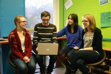 Sandbox team Dalhousie Sandbox team members sit around a computer