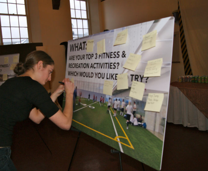 A Dalhousie student gives her input by writing what her top three fitness and recreation activities are.