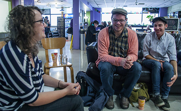 SUNSCAD president Sarah Trower (left) and ACORN activists Evan Coole (centre) and Shay Enxuga (right) get excited about fighting for rent control in N.S. (Photo: Claire Ciel Zimmerman)