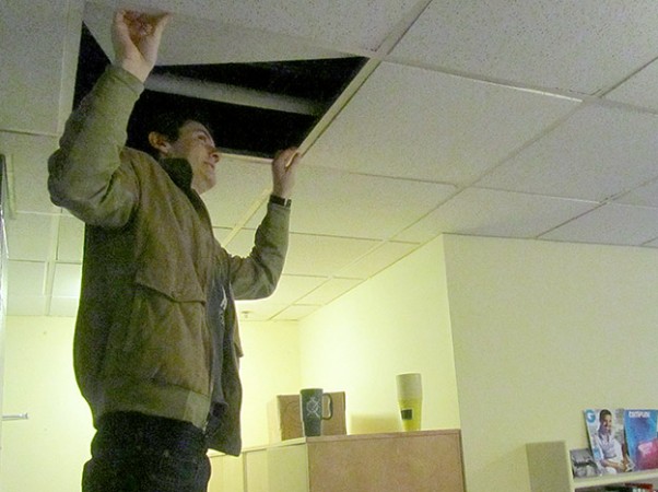 King’s student Colin Kelly demonstrates where facilities staff recently removed dead mice from his ceiling in Alexandra Hall.