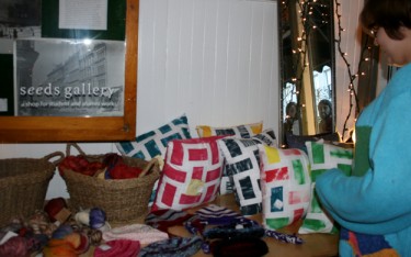 A basket of hand-dyed, hand-spun wool, and natural-dyed cushion cases were for sale. (Photo: Elsa Chang)