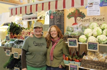 Varga (Left) and Smith (Right) at their Charlottetown Farmers Market booth. (Photo by: Heart Beet organics)