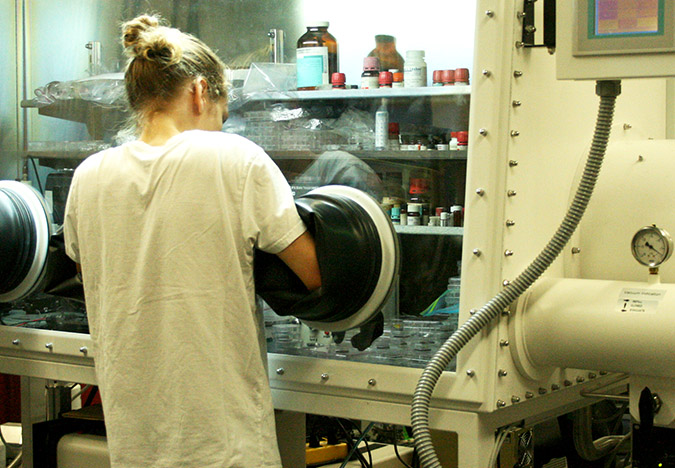 Masters student in chemistry Andrew Namespetra at the “glove box.” Photo: Elizabeth Whitten