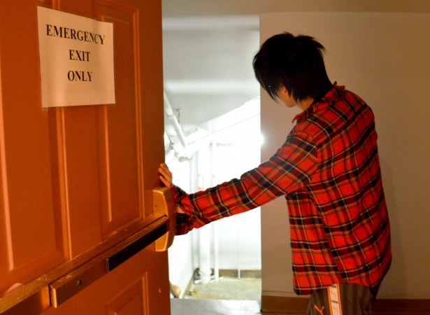A student at the University of King’s College peers down the emergency staircase