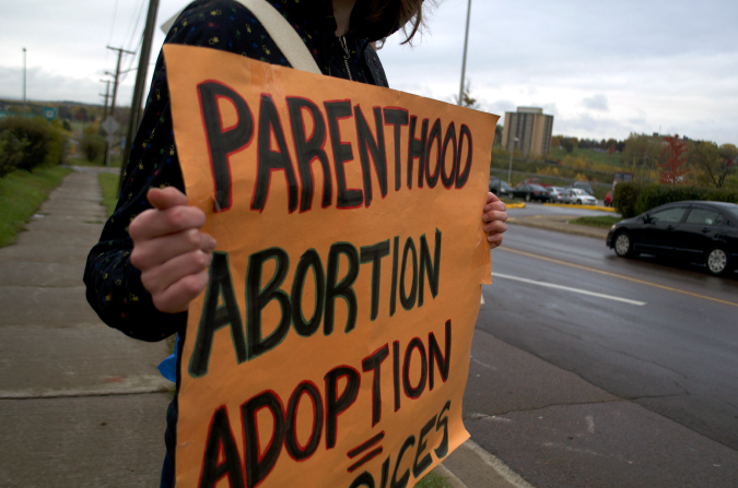 A pro-choice protester in Moncton, N.B. objects to the restrictions to abortion in the province. Photo: Rachel Richard