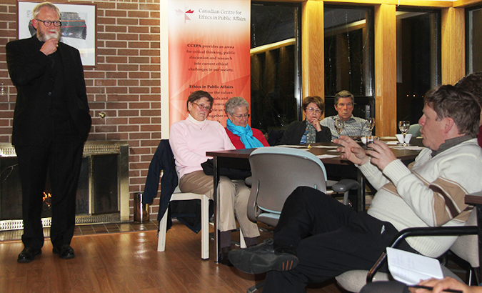 Father Gary Thorne, left, opens the floor to discussion at the CCEPA event. Photo: Benjamin Blum