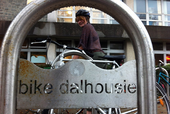 Ali Calladine retrieves her bike from a bike stand in front of Dal’s Student Union Building. Calladine has been cycling since she was two years old. Photo: Stephanie Brown