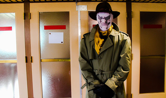 Photo of a man dressed as Rorschach (from Watchmen).