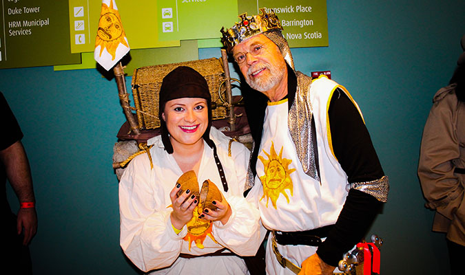 Photo of two people dressed as Patsy and King Arthur (from Monty Python).