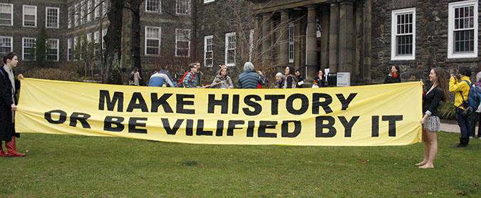 The banner outside the meeting showing the slogan for Divest Dal. Photo: Kashmala Fida