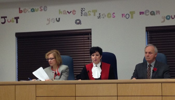 From left, Minister of Justice Lena Metlege Diab, Chief Judge of the Provincial and Family Courts of Nova Scotia, Pam Williams, and Minister of Health and Wellness Leo A. Glavine sit at a press conference Wednesday. Photo: Julia Manoukian