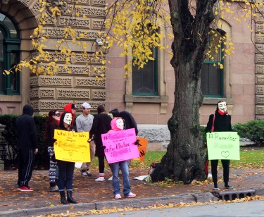 Protestors outside of the Provincial courts, fighting the publication ban