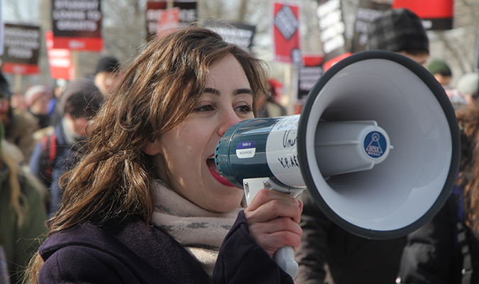 Dalhousie Student Union vice-president Jacqueline Skiptunis leads Dal and King’s students in chants as they march down University Avenue as part of the Day of Action. Photo: Andrea Gunn  