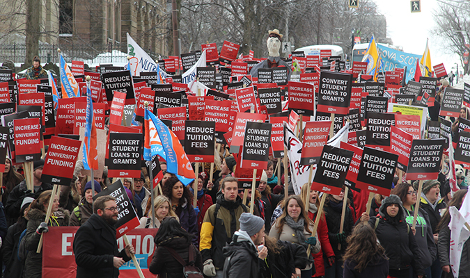 Masses of students turn from Spring Garden Road onto Barrington Street on their way to Province House during the Feb. 4 Day of Action. Photo: Andrea Gunn